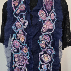 woven and stitched scarf over a sheer fabric